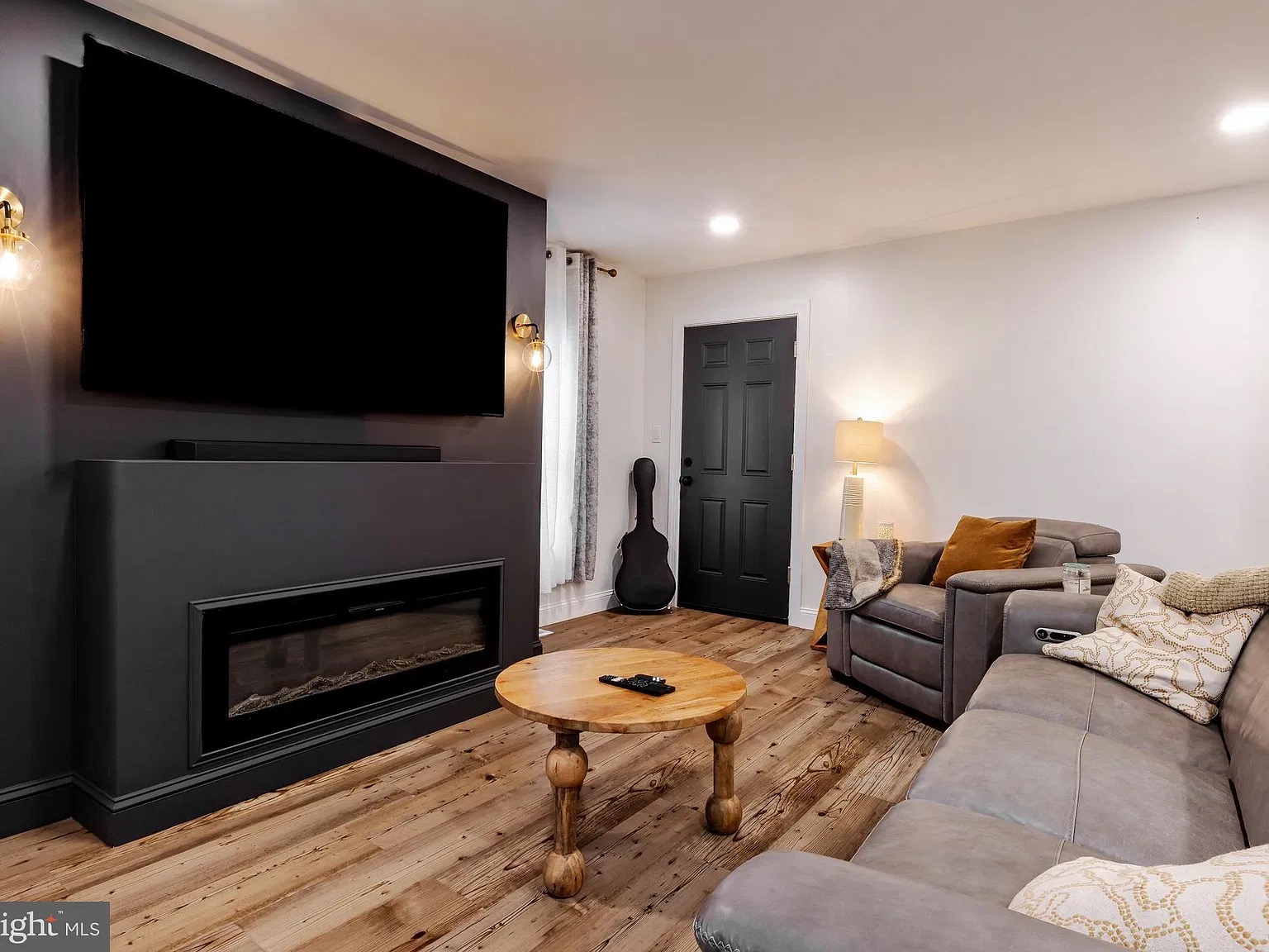 Blackwood House — photo 5 Living room with fireplace and television
